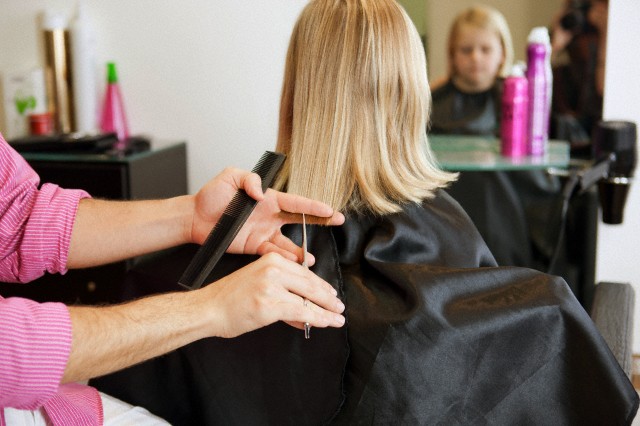 trimming hair - hair dressing in salon